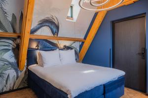 Postel nebo postele na pokoji v ubytování Hotel St Joris I Kloeg Collection