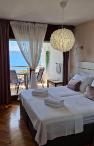 Posteľ alebo postele v izbe v ubytovaní Ocean apartman