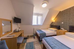 TV a/nebo společenská místnost v ubytování Pandora Hotel