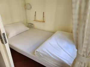 Postel nebo postele na pokoji v ubytování Munee Hostel Chiangmai