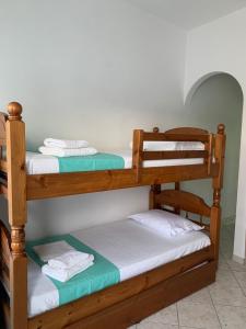 a couple of bunk beds in a room at Fabrika Apartment B2 in Vári