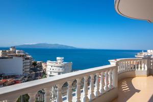 a balcony with a view of the ocean at Saranda Rooms in Sarandë +38 photos