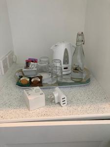 a counter top with a coffee maker and a blender at Hillcrest Bed & Breakfast in Eyemouth