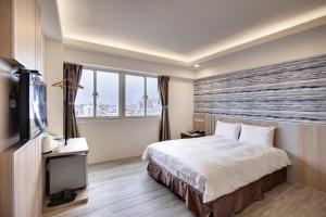 TV a/nebo společenská místnost v ubytování 天璽商務飯店 Cullinan Hotel