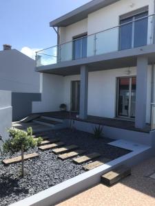 eine Darstellung eines Hauses mit Balkon in der Unterkunft Angeiras Beach House - Porto - Villa by the Sea in Lavra