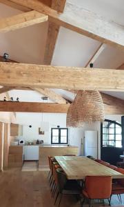 a kitchen and dining room with a table and chairs at Domaine de la Bastide Basse in Signes