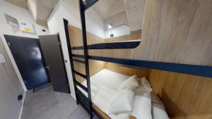 Un ou plusieurs lits superposés dans un hébergement de l'établissement IN Budapest Apartment 5