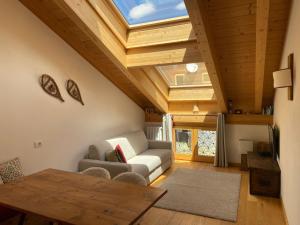a living room with a couch and a table at Alpine Escape in Bormio