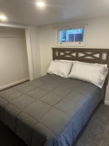 a large bed in a room with a window at Cyclist Retreat in downtown Fruita, Colorado in Fruita