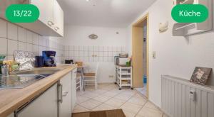 a kitchen with a sink and a counter top at Schloßblick in Blankenburg