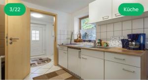 a kitchen with a sink and a counter top at Schloßblick in Blankenburg