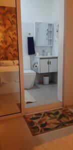 A bathroom at Apartment with swimming pool near beach