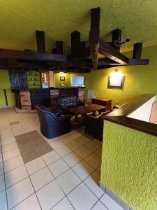 a living room with a couch and a table at Studio nad Kanałem in Kłodzko