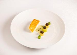 a white plate with some food on it at The Ritz London in London