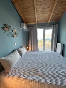 Postel nebo postele na pokoji v ubytování Emelia Apartment