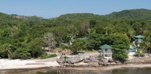 an aerial view of a house on the beach at Karlsson's Guesthouse in Larena