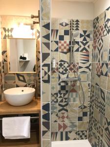 a bathroom with a shower and a sink at La Treille Muscate in Cliousclat +59 photos