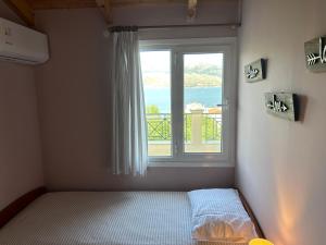 Postel nebo postele na pokoji v ubytování Emelia Apartment