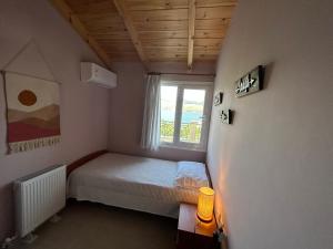 Postel nebo postele na pokoji v ubytování Emelia Apartment