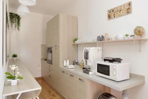 a kitchen with a white microwave on a counter at B&B Felicioni in Fiumicino