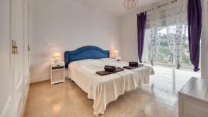 Posteľ alebo postele v izbe v ubytovaní Costacabana - Villa Sunrise