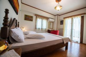 Postel nebo postele na pokoji v ubytování VILLA ALOLEA