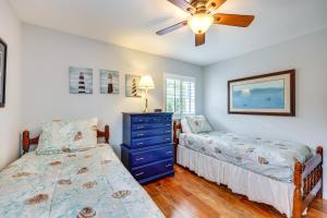 a bedroom with two beds and a ceiling fan at St Augustine Vacation Rental with Private Hot Tub! in St. Augustine