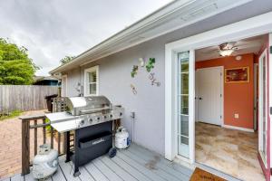 a backyard kitchen with a grill and a patio at St Augustine Vacation Rental with Private Hot Tub! in Saint Augustine