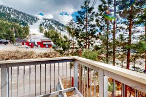 a balcony with a view of a snow covered mountain at Saddle Road Sanctuary in South Lake Tahoe