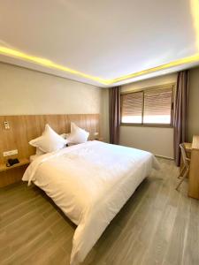 Voodi või voodid majutusasutuse HOTEL CAFE PALAIS SALAM , Beni Mellal toas