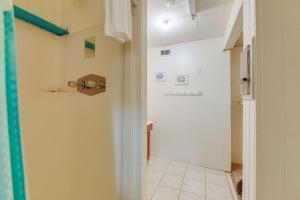 a bathroom with a hallway with a sink and a toilet at 2 Blocks to Bay Cabana Breeze Rockport Rental! in Rockport +22 photos