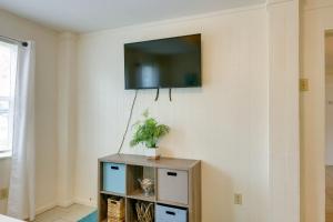 a living room with a tv on a wall at Beautiful Rockport Home - Walk to Aransas Bay! in Rockport