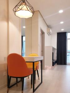 a dining room with a table and two chairs at Charming Studio 1BR 1LR Condo Georgetown 魅力一室一厅套房 in George Town