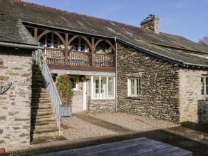 a brick house with a deck on the side of it at Bassicks at the Graythwaite Estate in Ulverston