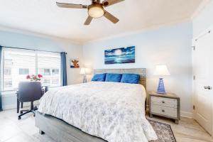 a bedroom with a bed and a ceiling fan at Palm Beach C52 in Orange Beach