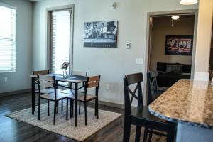 a dining room with a table and chairs in a room at Beautiful TownHome With Garage in Las Vegas in Las Vegas