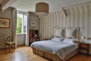 Łóżko lub łóżka w pokoju w obiekcie Clerval Maison d'hôtes et Gîtes