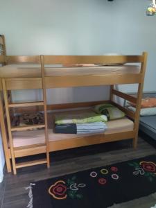 a wooden bunk bed with at Mikin vajat i ribnjak Korenita, Loznica in Loznica