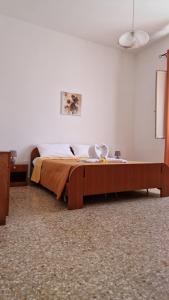 a bedroom with a bed in a room at La campagna di Manuel in Tuglie