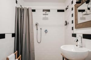 a bathroom with a sink and a shower at Tra le case di Reggio - Passo Buole in Reggio Emilia
