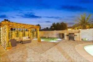 a backyard with a pergola and a pool at El Descanso in Meyer Park - Heated Pool in Tempe
