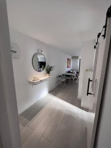a hallway with a mirror and a sink in a room at Apartamento Casa Carmen Teguisol in Costa Teguise