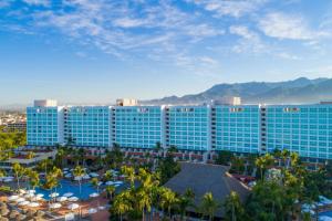 an aerial view of a resort with palm trees and buildings at Sheraton Buganvilias Resort & Convention Center in Puerto Vallarta