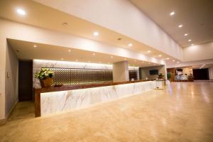 a lobby with a reception desk in a building at Sheraton Buganvilias Resort & Convention Center in Puerto Vallarta