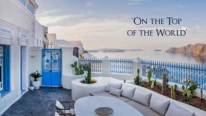 a balcony with the words on the top of the world at Oia Mansion in Oia