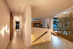 a hallway of a house with a white wall at Vyn Guest House Hout Bay in Hout Bay