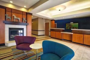 a lobby with two chairs and a fireplace at Fairfield Inn and Suites by Marriott McAllen in McAllen