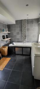 a large kitchen with a sink and a counter at Libenliny in Durbuy