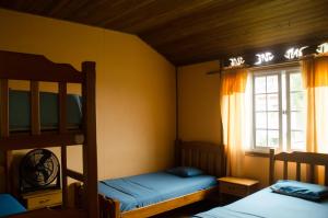 a bedroom with two bunk beds and a window at Spanish by the Sea - Bocas in Bocas Town