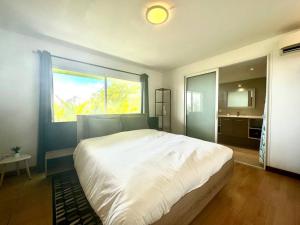 מיטה או מיטות בחדר ב-View apartment - St Barts